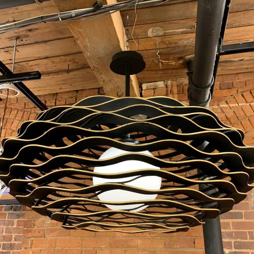 Waved Chandelier in Black and Gold Accent. One Globe Sahde Inside.