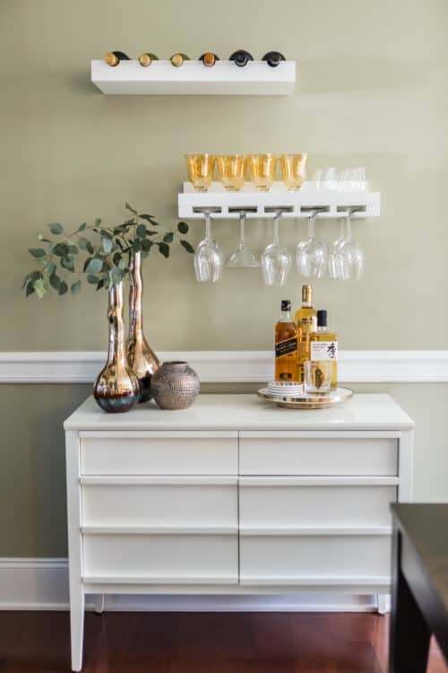 dining room bar floating shelves wine glass rack silver vase alcohol white dresser