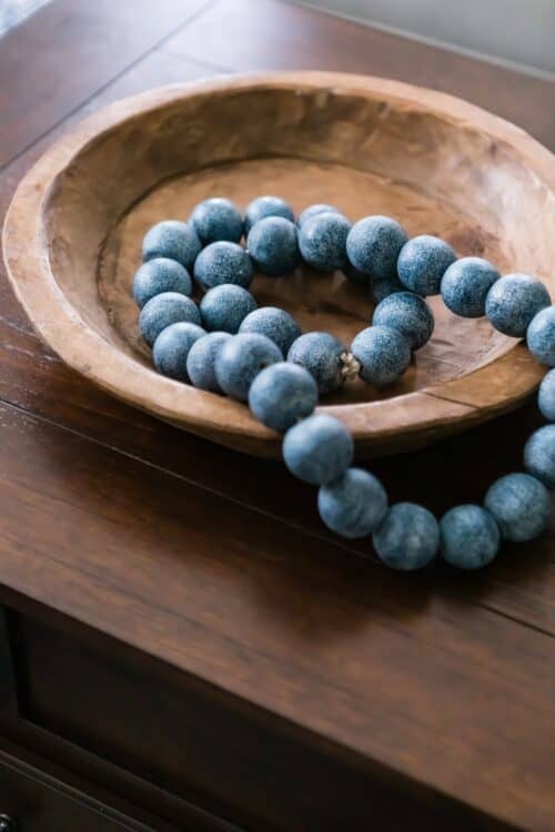 wooden bowl large blue bead necklace