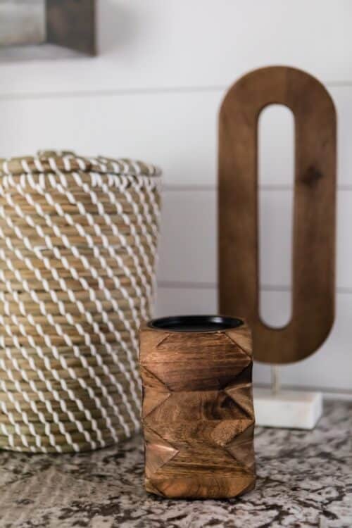 decor accessories brown wood pencil holder wooden letter O wicker basket marble counter