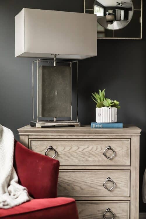 master bedroom red velvet armchair nightstand lamp succulents LK Design