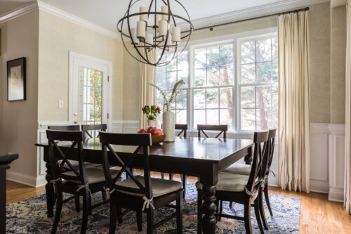interior design dining room round chandelier curtains draperies vase eucalyptus branches