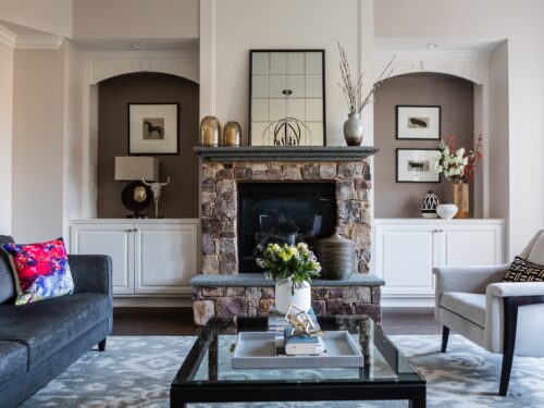 interior design living room stone fireplace built-in shelves art decor accessories