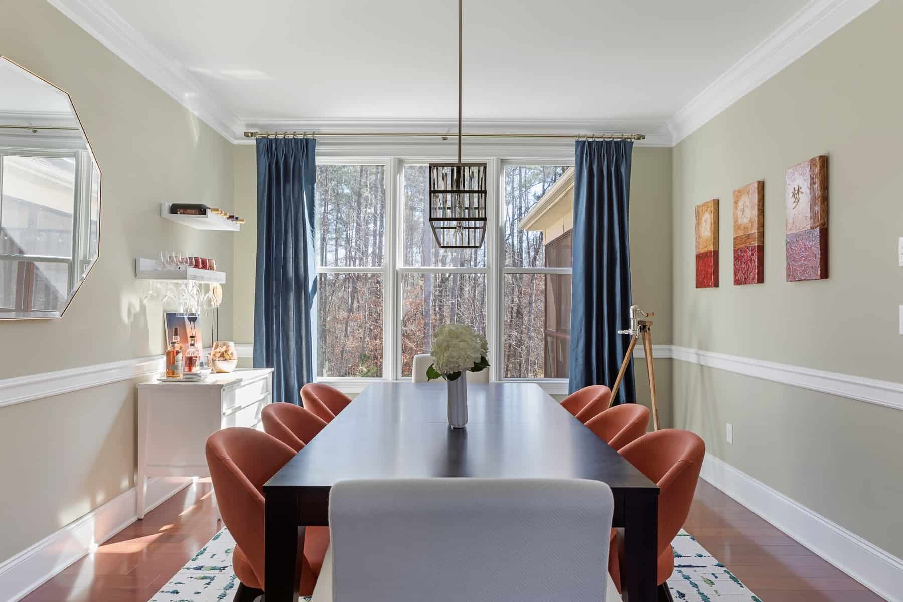 interior design dining room orange chairs blue curtains modern table lk design Durham NC