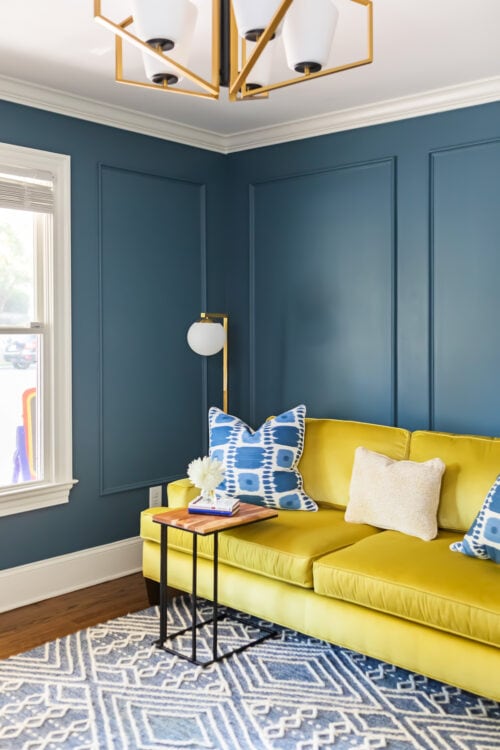 LK Design Durham colorful guest bedroom blue walls yellow sofa