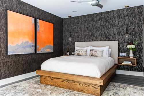 LK Design of Durham master bedroom interior design bedside table headboard orange abstract art