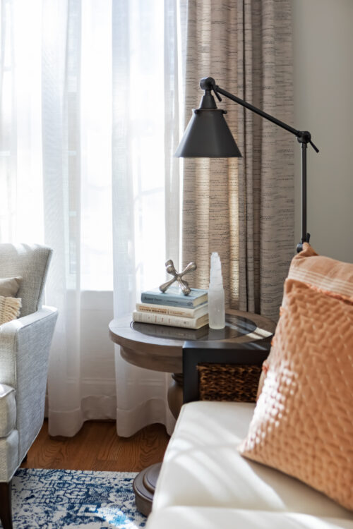 LK Design Home library beige armchair lamp pillows custom window treatments curtains