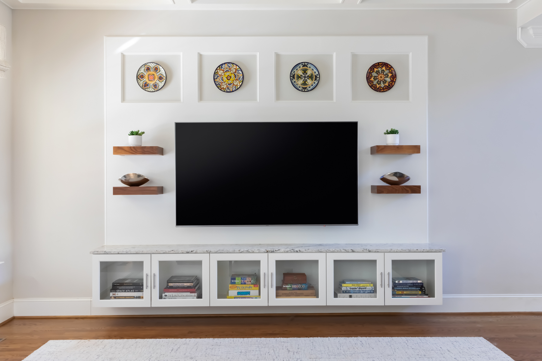 LK Design living room custom built TV wall white floating shelves and decor items